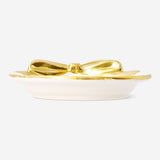 Small 9 cm ceramic dish with gold bow detail, designed for home decor, by Flying Tiger Copenhagen.
