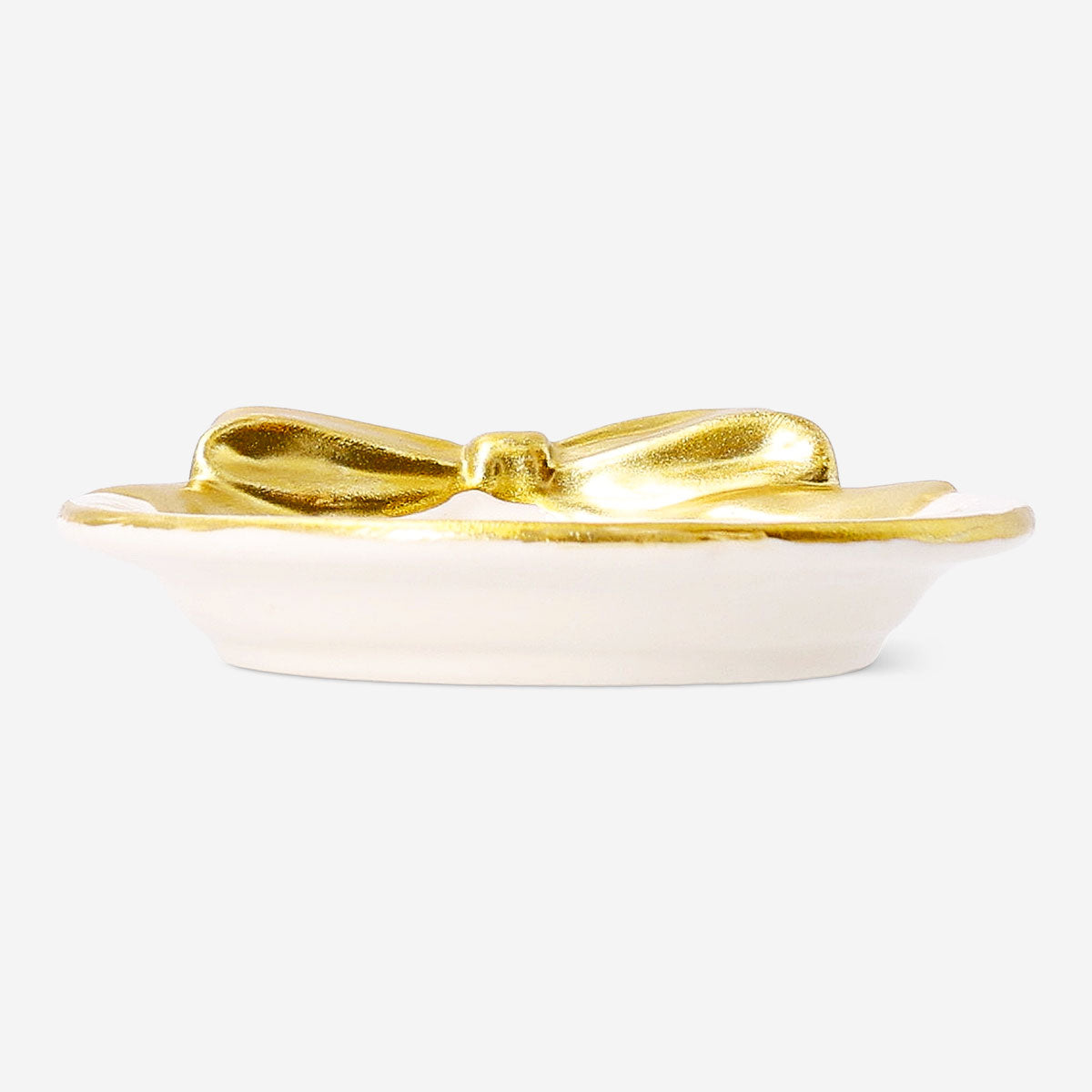 Small 9 cm ceramic dish with gold bow detail, designed for home decor, by Flying Tiger Copenhagen.