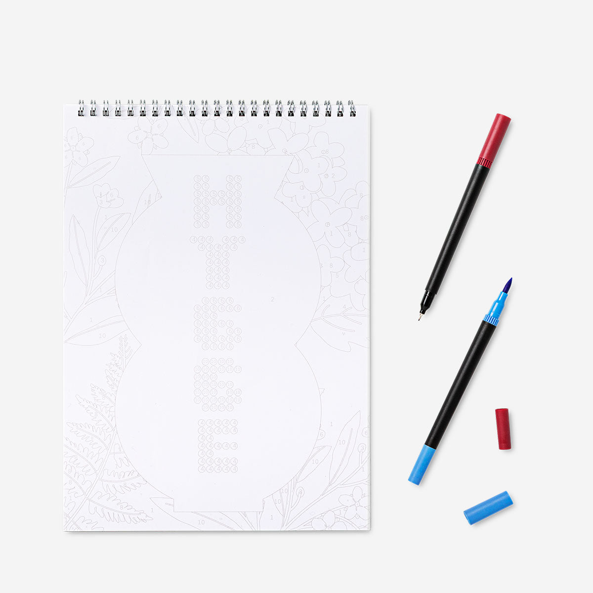 Colour by numbers colouring pad with markers by Flying Tiger Copenhagen for hobby arts and crafts, featuring colorful pages and vibrant markers.