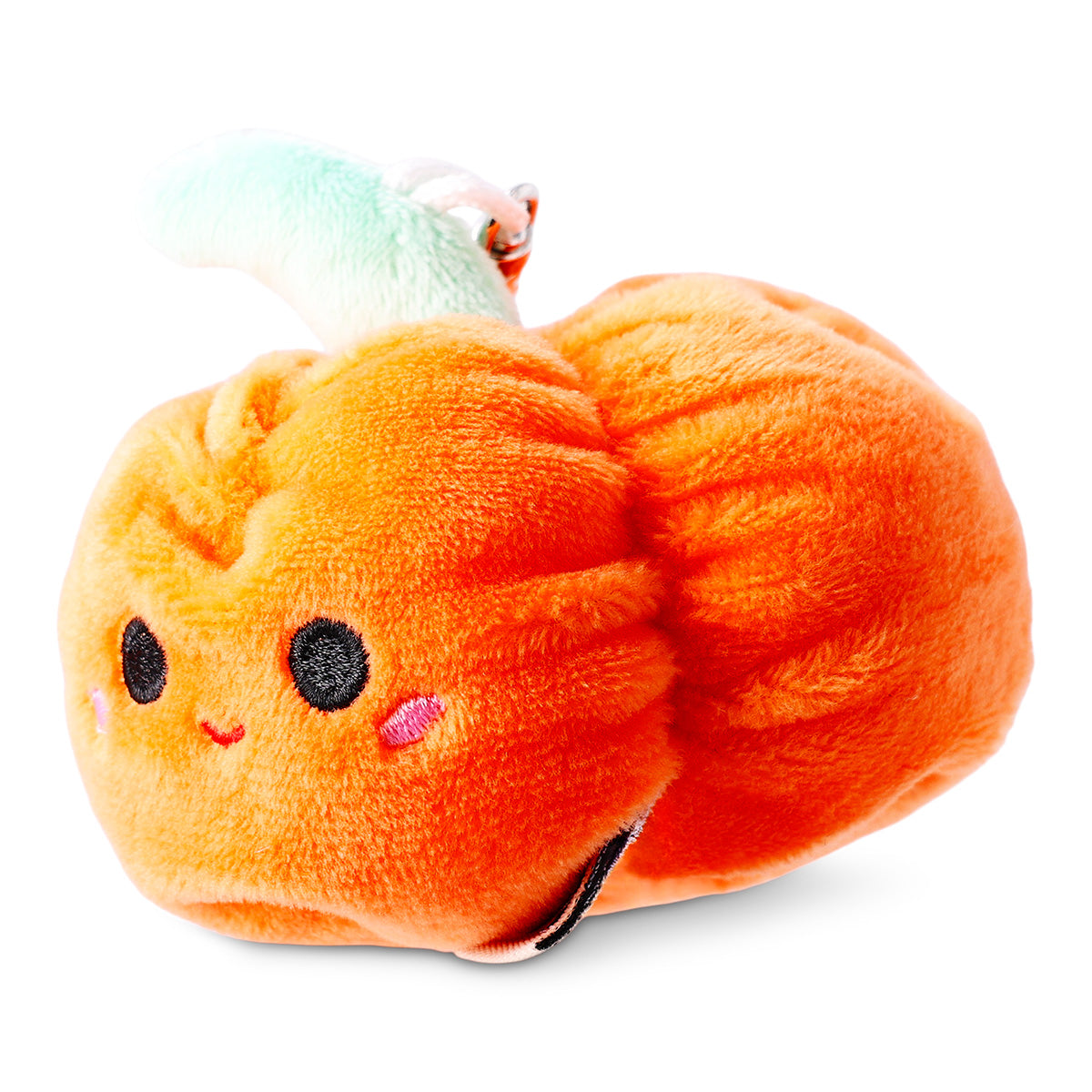 Flying Tiger Copenhagen plush pumpkin keychain featuring a soft, orange pumpkin toy with a smiling face and green stem detail.