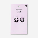 Black studded heart earrings made of textile, featuring a fashionable heart design by Flying Tiger Copenhagen.