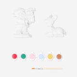 DIY plaster Christmas figures hobby kit by Flying Tiger Copenhagen with unpainted holiday-themed figurines for craft projects.
