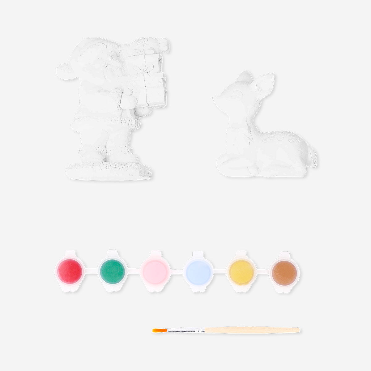 DIY plaster Christmas figures hobby kit by Flying Tiger Copenhagen with unpainted holiday-themed figurines for craft projects.