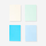 Four Flying Tiger Copenhagen A5 solid color office notebooks with smooth covers and elastic closures.