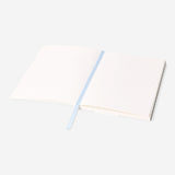 A5 floral bullet planner from Flying Tiger Copenhagen with colorful floral cover and open pages for planning and organization.