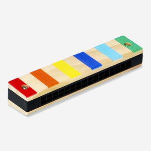 Wooden toy harmonica by Flying Tiger Copenhagen, showing a small, colorful wooden musical instrument for children.