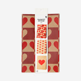 Set of three Flying Tiger Copenhagen paper gift bags with heart print, perfect for office gifting and special occasions.