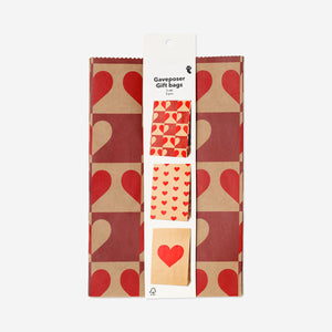 Set of three Flying Tiger Copenhagen paper gift bags with heart print, perfect for office gifting and special occasions.