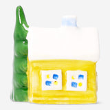 Small ceramic house for LED light by Flying Tiger Copenhagen, featuring a cozy, decorative home accent with detailed windows and roof.