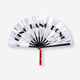 Silver textile fan with strap from RuPaul's Drag Race x Flying Tiger Copenhagen, featuring a sleek, metallic finish and compact design.