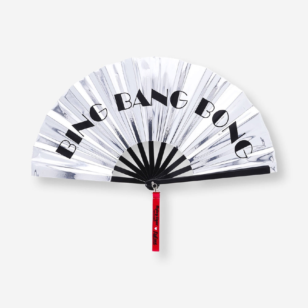Silver textile fan with strap from RuPaul's Drag Race x Flying Tiger Copenhagen, featuring a sleek, metallic finish and compact design.