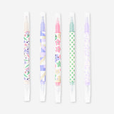 Set of four Flying Tiger Copenhagen dual-tip pens with gel ink and highlighters, featuring colorful caps and versatile writing tips.
