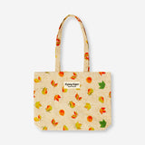 Textile tote bag featuring autumn leaves design by Flying Tiger Copenhagen, showcasing vibrant fall colors and leaf patterns.