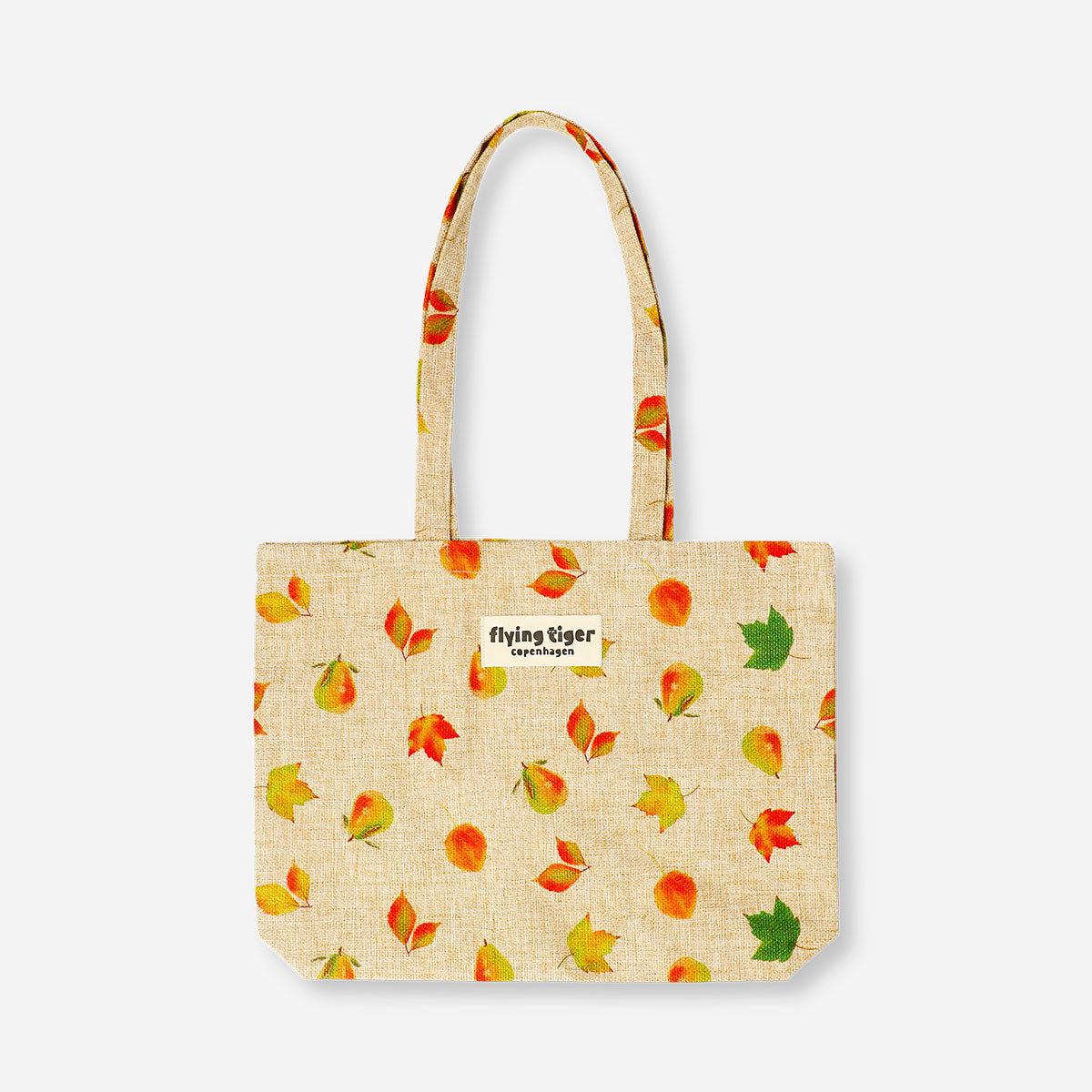 Textile tote bag featuring autumn leaves design by Flying Tiger Copenhagen, showcasing vibrant fall colors and leaf patterns.