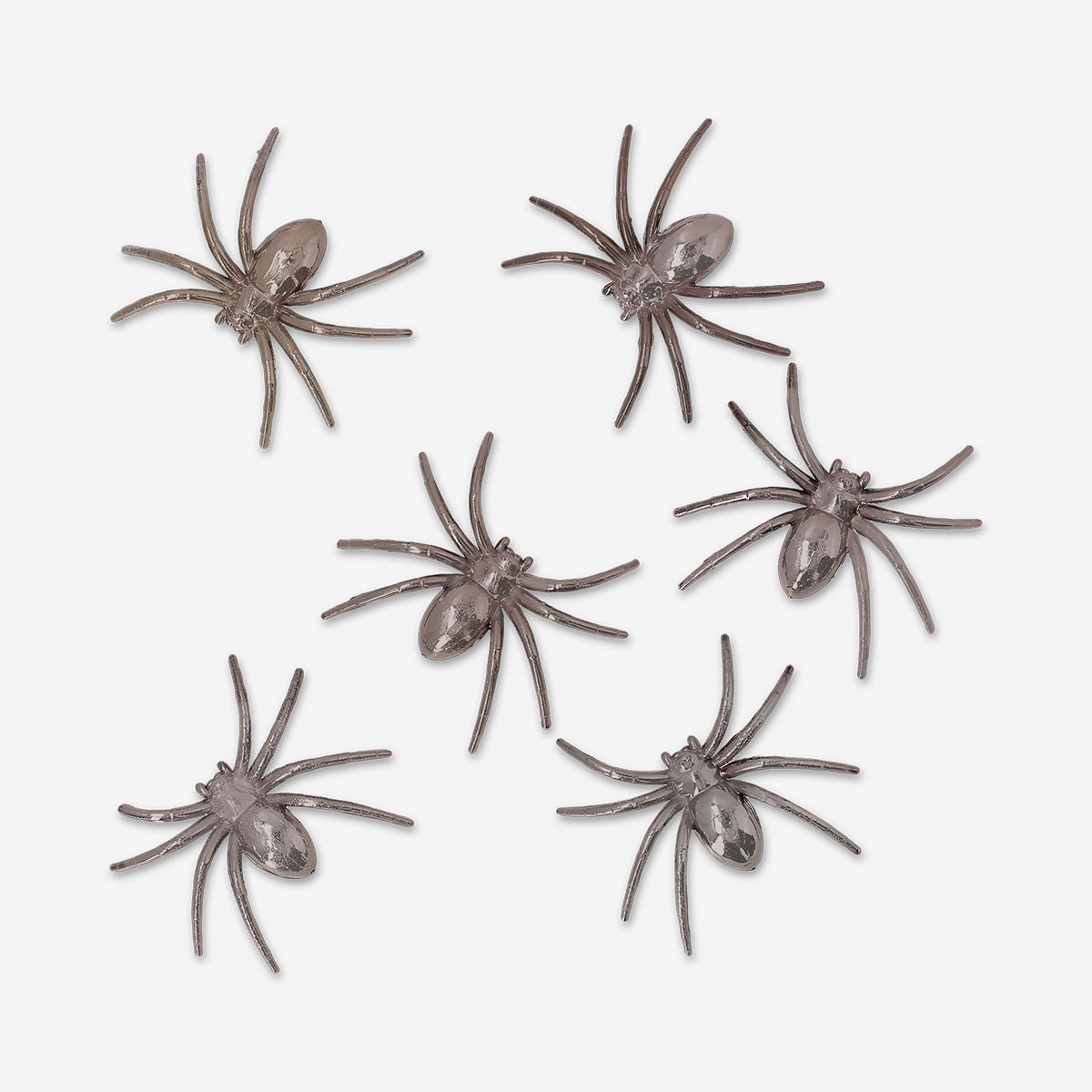 Six decorative metallic spiders for party decor, featuring shiny finishes and detailed designs from Flying Tiger Copenhagen.