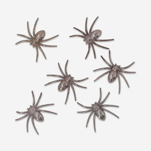 Six decorative metallic spiders for party decor, featuring shiny finishes and detailed designs from Flying Tiger Copenhagen.