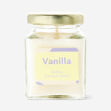Flying Tiger Copenhagen vanilla scented candle, home decor with a simple glass container and a warm, inviting vanilla fragrance.