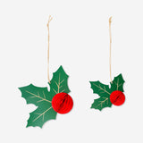 Two hanging honeycomb hollies in yellow for party decorations, by Flying Tiger Copenhagen, shown in the image.