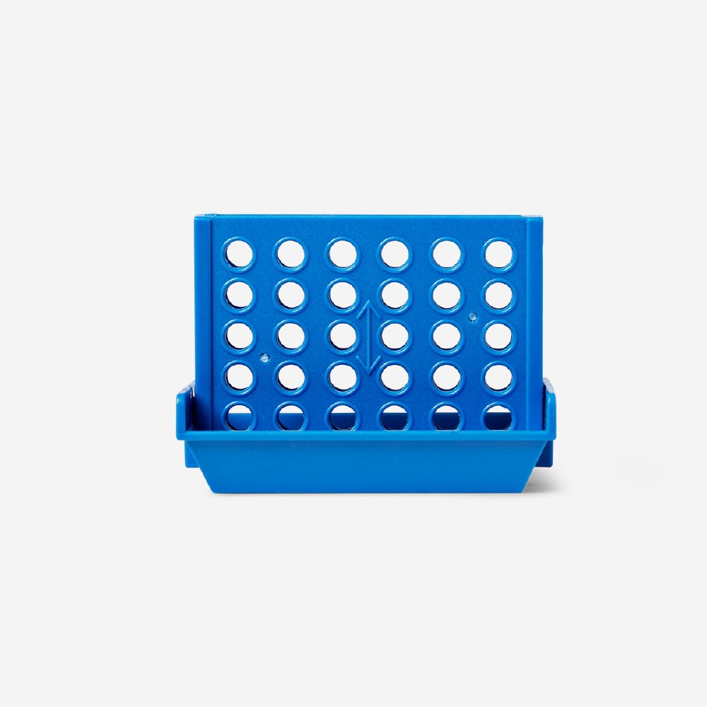 Mini Four in a Row game by Flying Tiger Copenhagen featuring a colorful plastic game board and red and yellow game pieces.