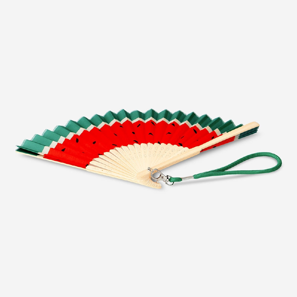 Foldable bamboo fan with watermelon print and strap, Flying Tiger Copenhagen textile accessory, ideal for cooling and style.