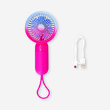 Gradient pink handheld fan with strap from Flying Tiger Copenhagen, compact gadget perfect for cooling on the go.