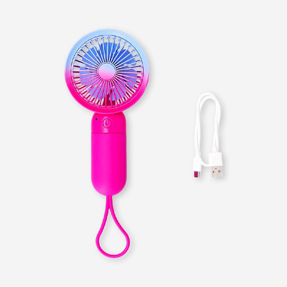 Gradient pink handheld fan with strap from Flying Tiger Copenhagen, compact gadget perfect for cooling on the go.