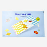 Wooden cornhole game by Flying Tiger Copenhagen with two sets of bean bags and a sturdy wooden board for outdoor fun.