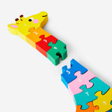 Wooden giraffe number puzzle toy by Flying Tiger Copenhagen, featuring colorful numbered pieces for kids' educational play.