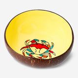 Handpainted coconut bowls by Flying Tiger Copenhagen, featuring colorful tropical designs perfect for serving snacks or salads.