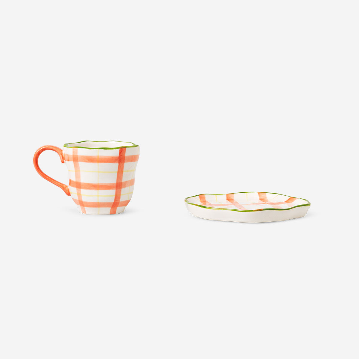 Hand-painted chequered design mug with saucer, 200 ml, in the kitchen collection by Flying Tiger Copenhagen.