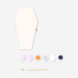 DIY wooden coffin craft kit with paint from Flying Tiger Copenhagen, featuring unfinished wood and colorful paint supplies.