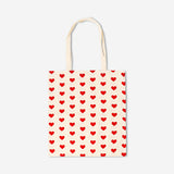 Flying Tiger Copenhagen heart print textile tote bag with sturdy handles and vibrant heart design on natural fabric.