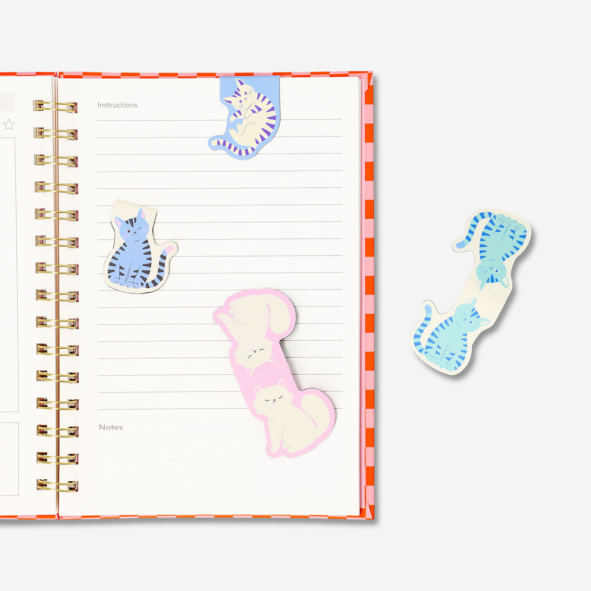 Four cat-themed magnetic bookmarks from Flying Tiger Copenhagen, colorful and cute office accessories for marking pages.