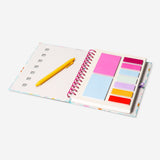 Flying Tiger Copenhagen floral office notebook with page markers and a pen, featuring colorful floral cover design and organized pages.