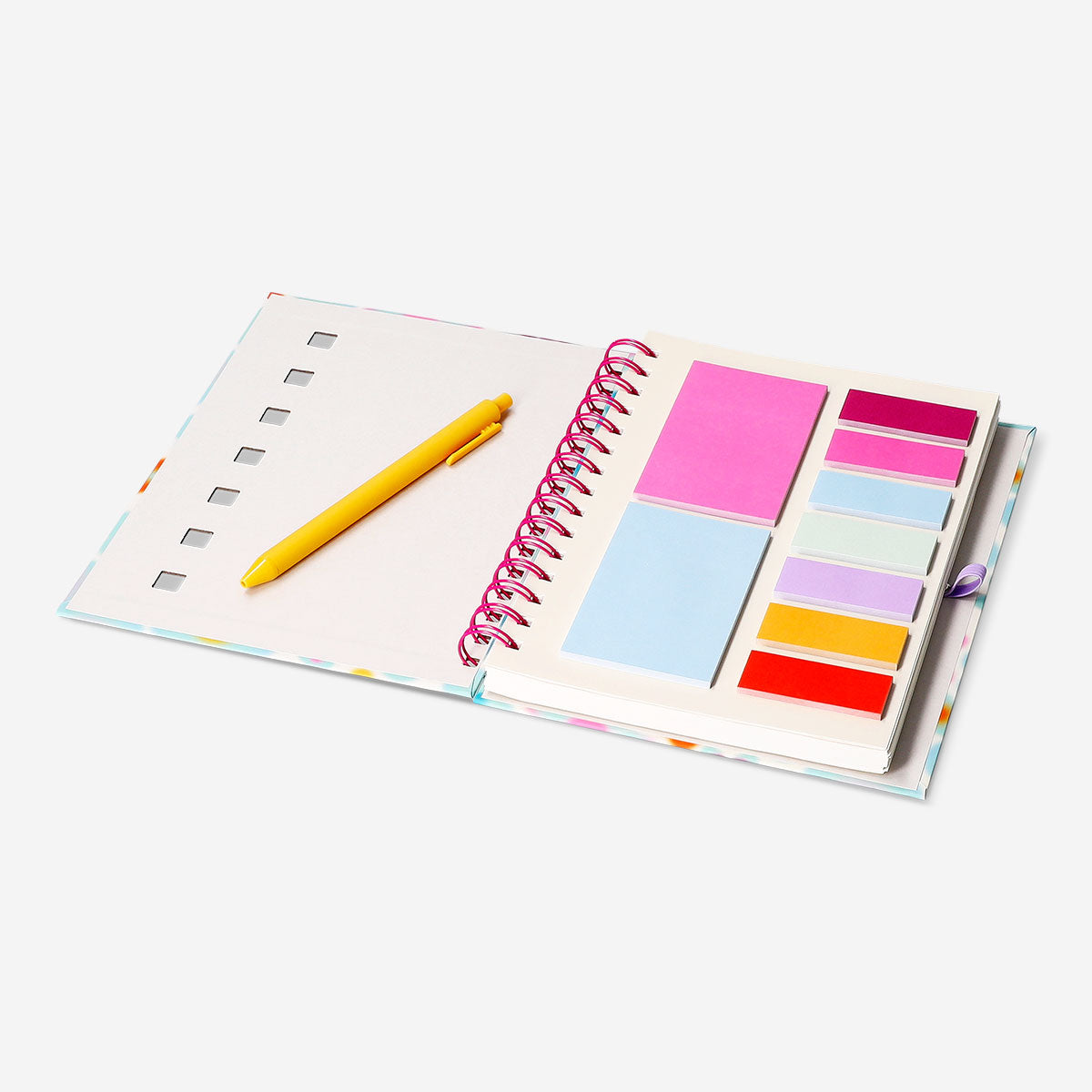 Flying Tiger Copenhagen floral office notebook with page markers and a pen, featuring colorful floral cover design and organized pages.
