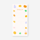Office shopping list with magnet from Flying Tiger Copenhagen, featuring colorful paper sheets and a magnetic backing for easy attachment.