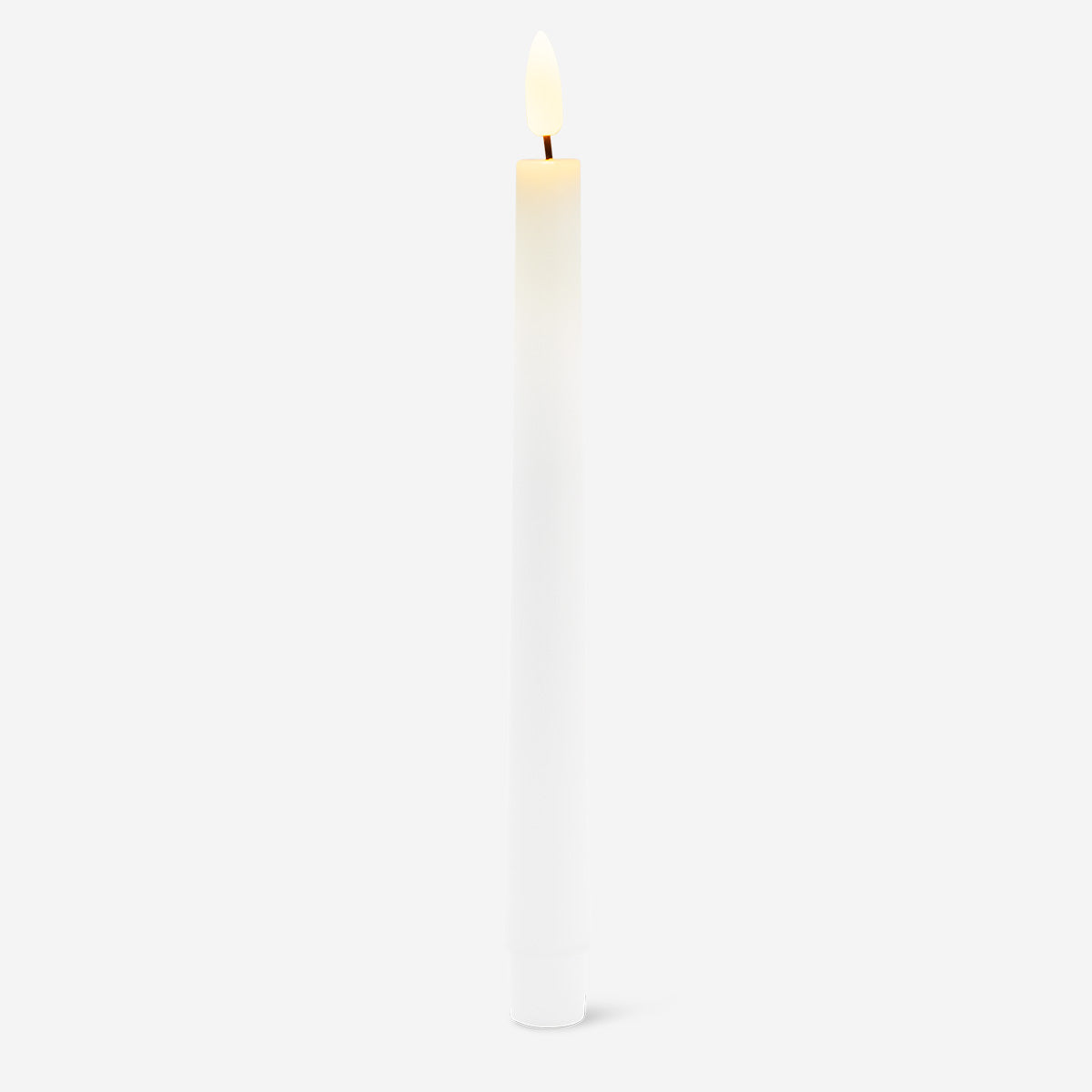 White LED dinner candle for home decor by Flying Tiger Copenhagen, showcasing a sleek, modern flameless candle with a realistic flickering effect.