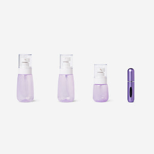 Purple Flying Tiger Copenhagen travel set with perfume bottle and leisure accessories on a white background.