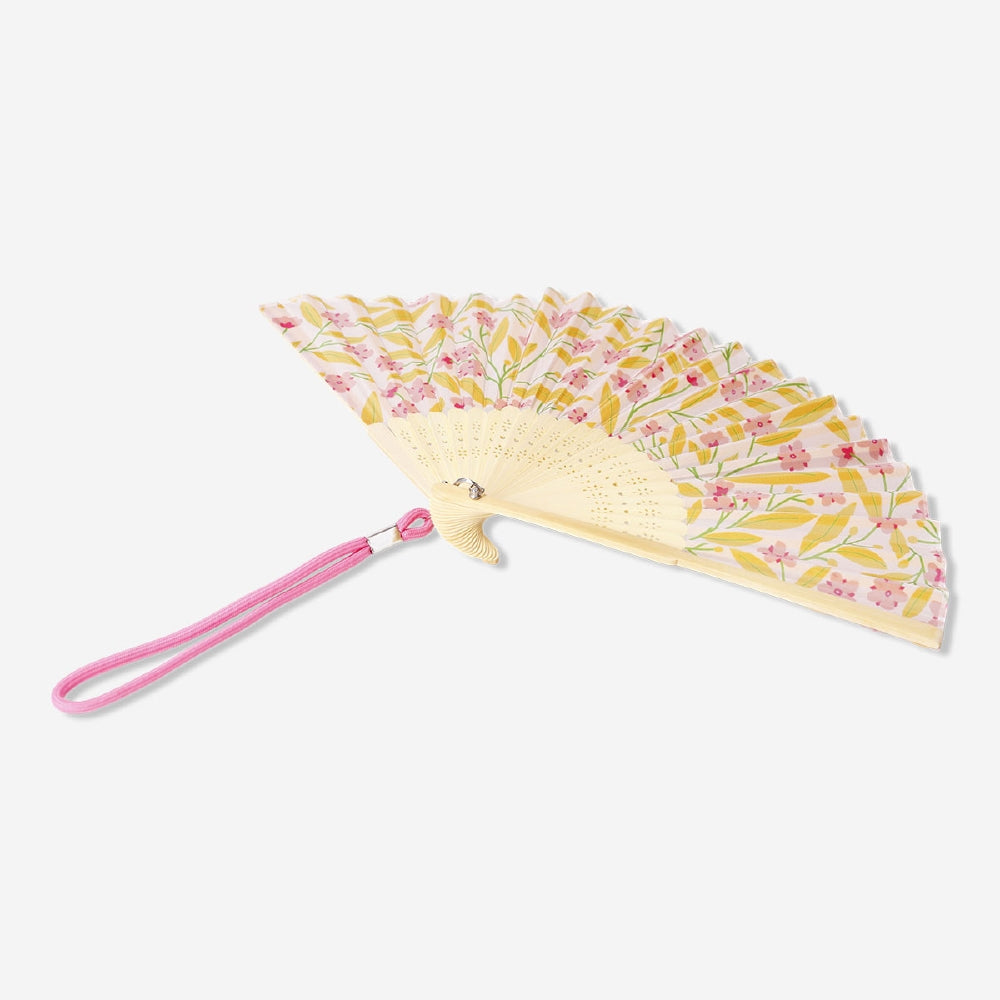 Foldable bamboo fan with flower print and strap, textile material, by Flying Tiger Copenhagen, shown unfolded with intricate floral design.