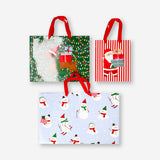 Set of three Flying Tiger Copenhagen Christmas print gift bags for office gift wrapping, featuring festive holiday designs.