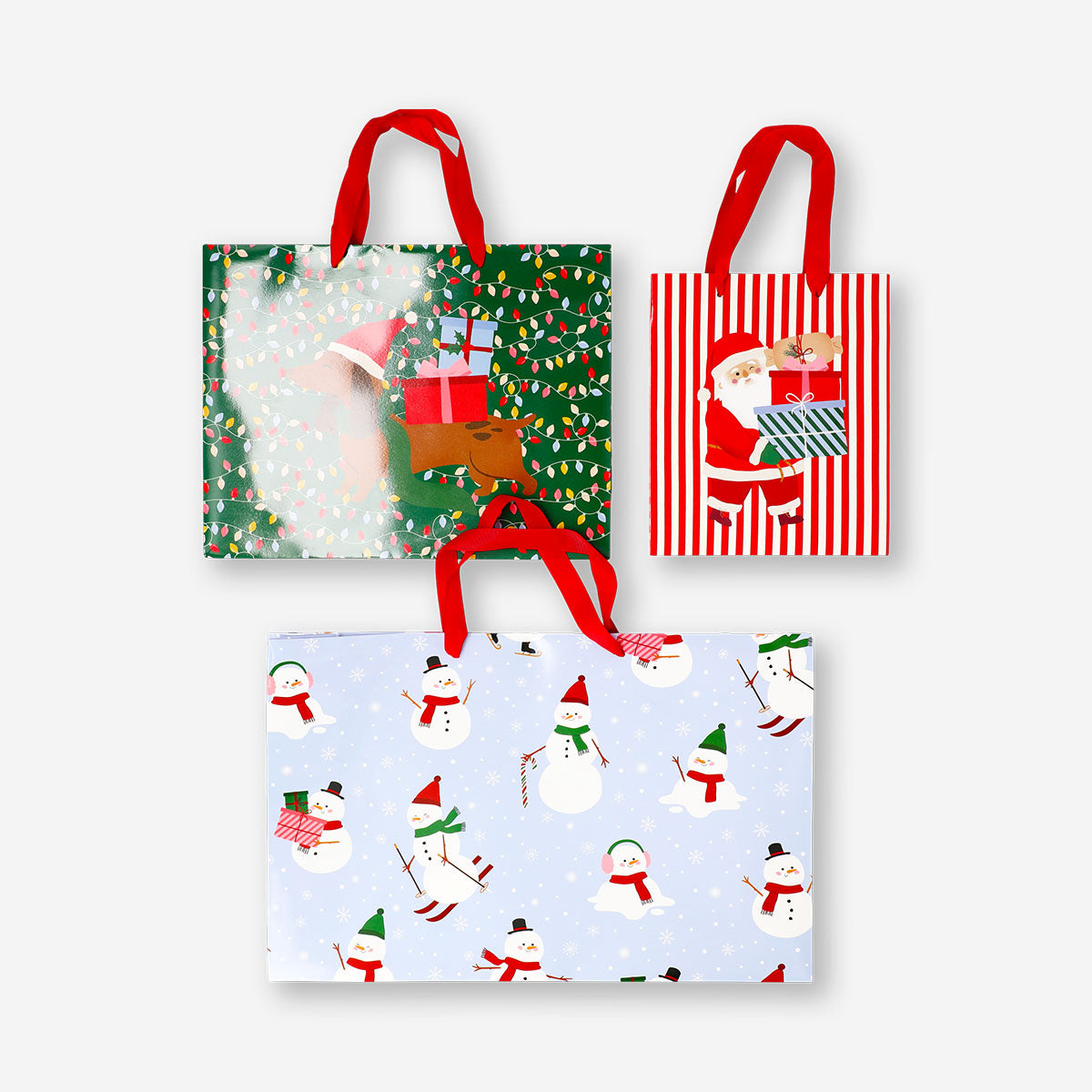 Set of three Flying Tiger Copenhagen Christmas print gift bags for office gift wrapping, featuring festive holiday designs.