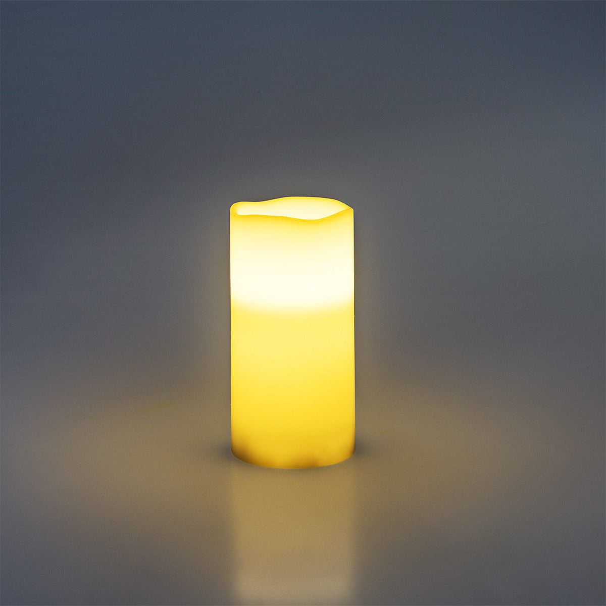 White LED pillar candle from Flying Tiger Copenhagen, 15 cm tall, ideal for home decor and ambient lighting.