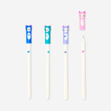 Set of four glitter gel pens with cute cat toppers from Flying Tiger Copenhagen, ideal for office or school use.