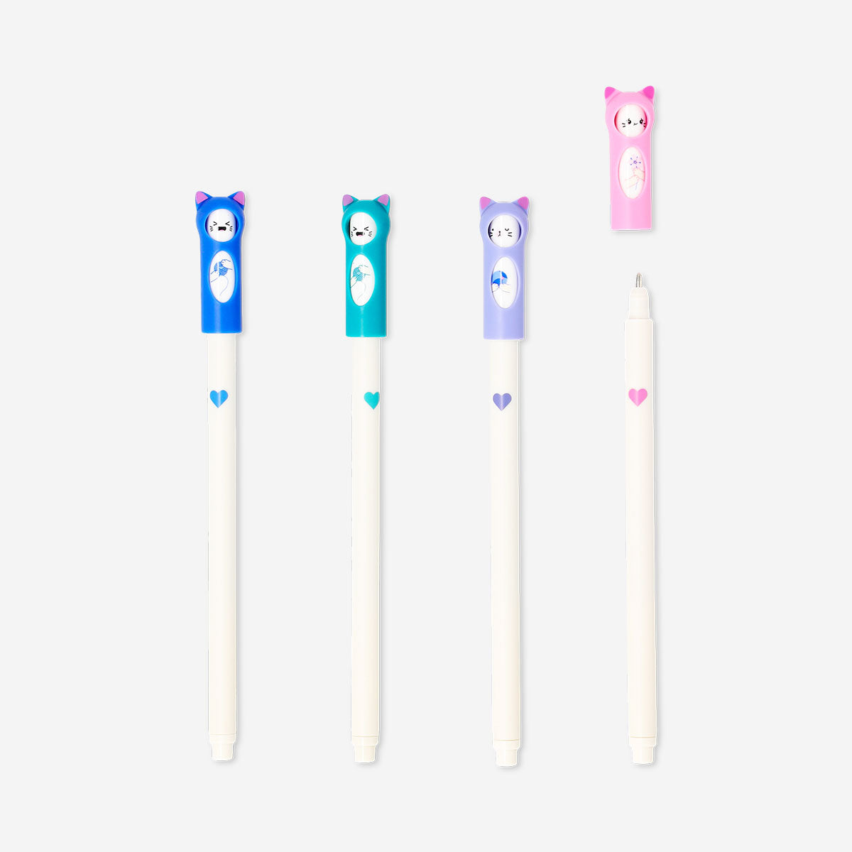 Set of four glitter gel pens with cute cat toppers from Flying Tiger Copenhagen, ideal for office or school use.