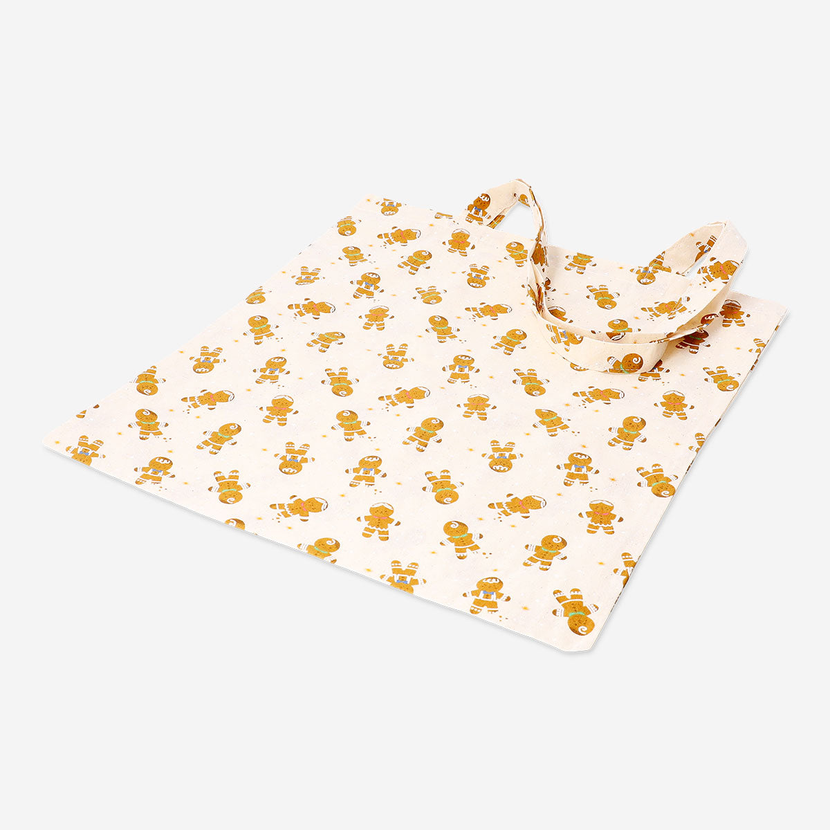 Textile tote bag featuring playful gingerbread people design, ideal for everyday use and stylish carrying by Flying Tiger Copenhagen.