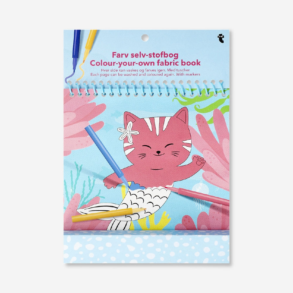Colorful DIY fabric book from Flying Tiger Copenhagen, showcasing pages with textured fabrics and creative craft elements.