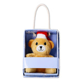 Mini plush teddy bear toy from Flying Tiger Copenhagen inside a box, soft and cuddly with a friendly expression.