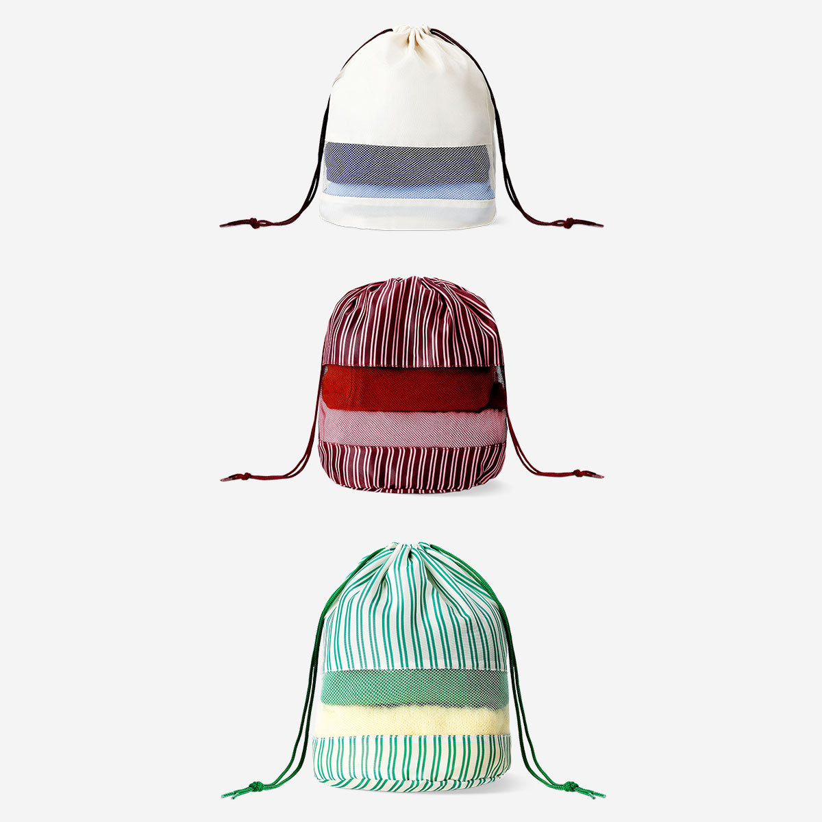 Set of three Flying Tiger Copenhagen leisure drawstring organiser bags with colorful designs and compact storage pockets.