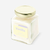 Flying Tiger Copenhagen scented vanilla candle for home decor, showing a lit candle in a decorative holder.