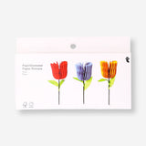 Three honeycomb paper flower decorations in pastel colors, ideal for party decor, by Flying Tiger Copenhagen.